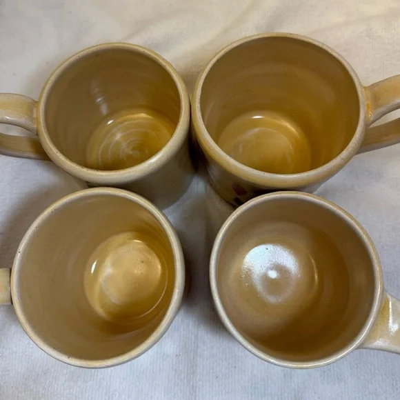 4/ studio art mugs. Tan with Black and Red Accents - Picture 4 of 5